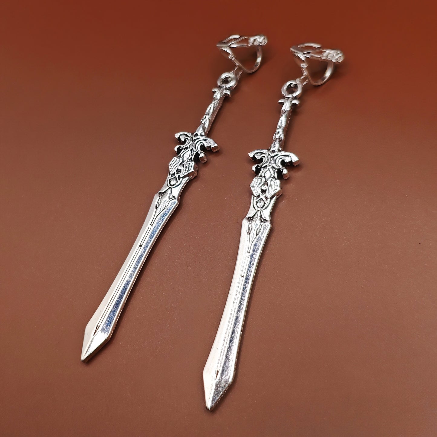 Clip on sword earrings for gamers, roleplayers, and lovers of medieval or gothic style.