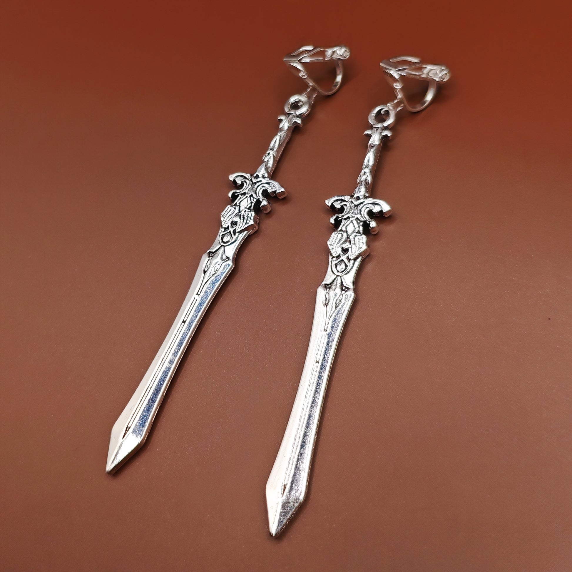 Clip on sword earrings for gamers, roleplayers, and lovers of medieval or gothic style.