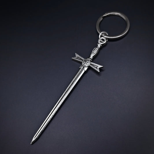 Silver keychain with a medieval sword design on a dark background