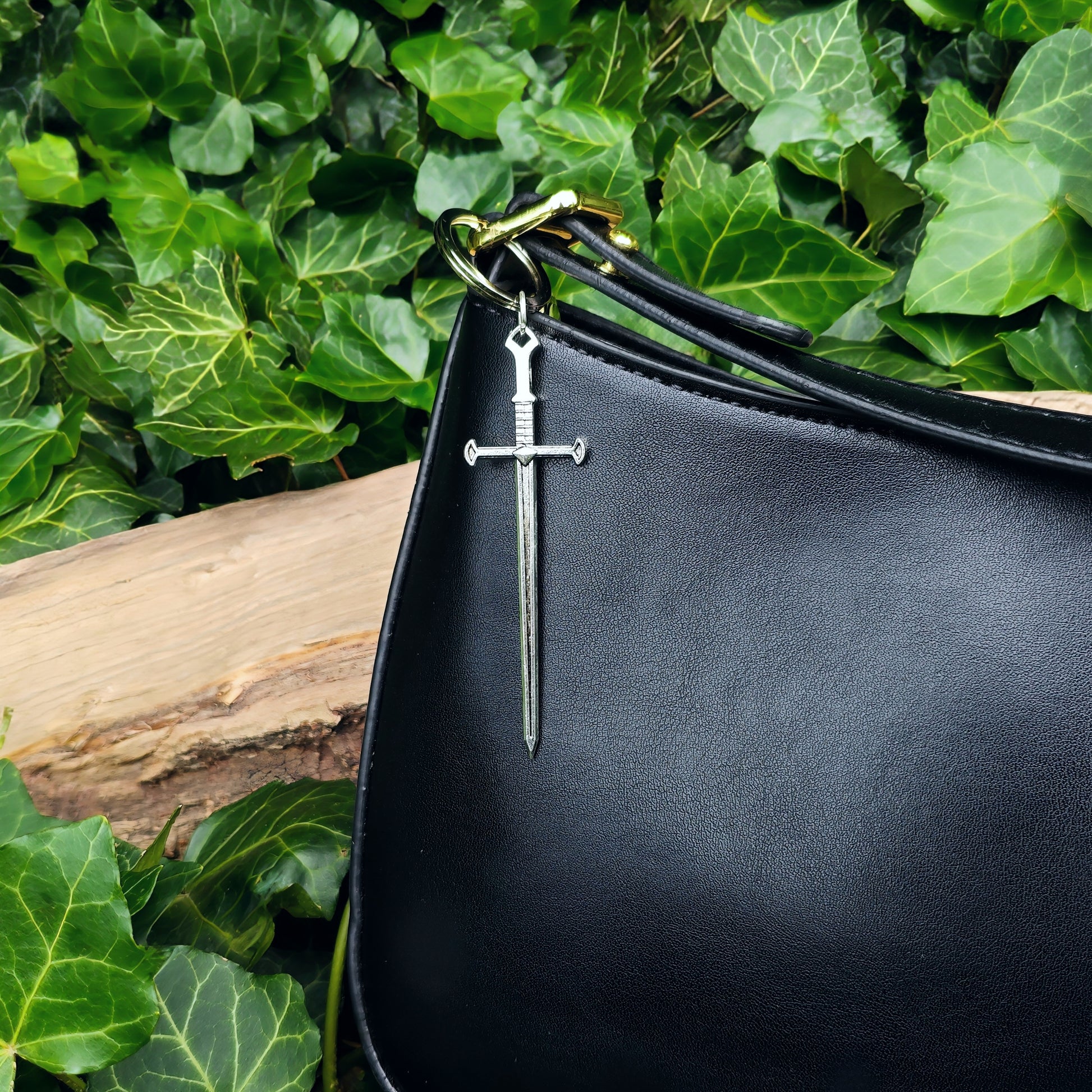 Sword keyring shown on a black handbag as a charm or bag accessory
