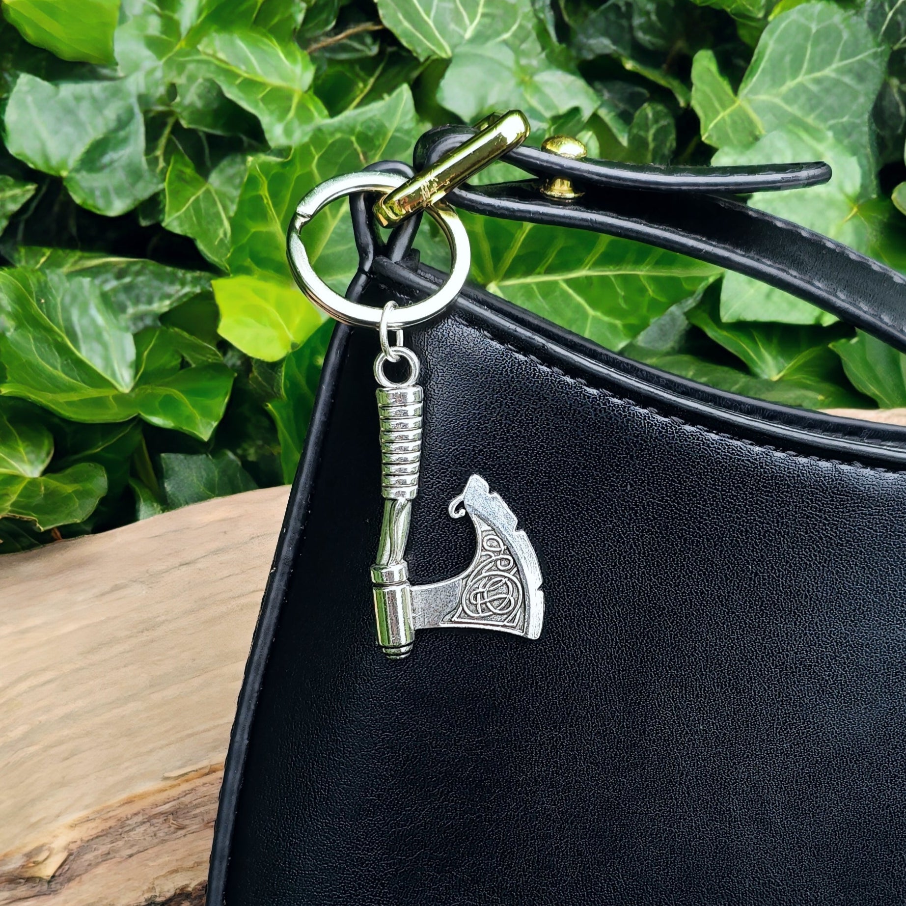 Axe keyring shown on a black handbag as a charm or bag accessory