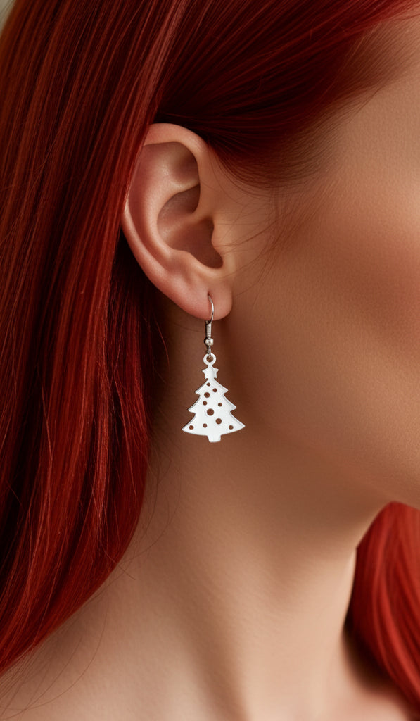 Woman with red hair wearing Christmas tree earrings with hooks made from silver stainless steel