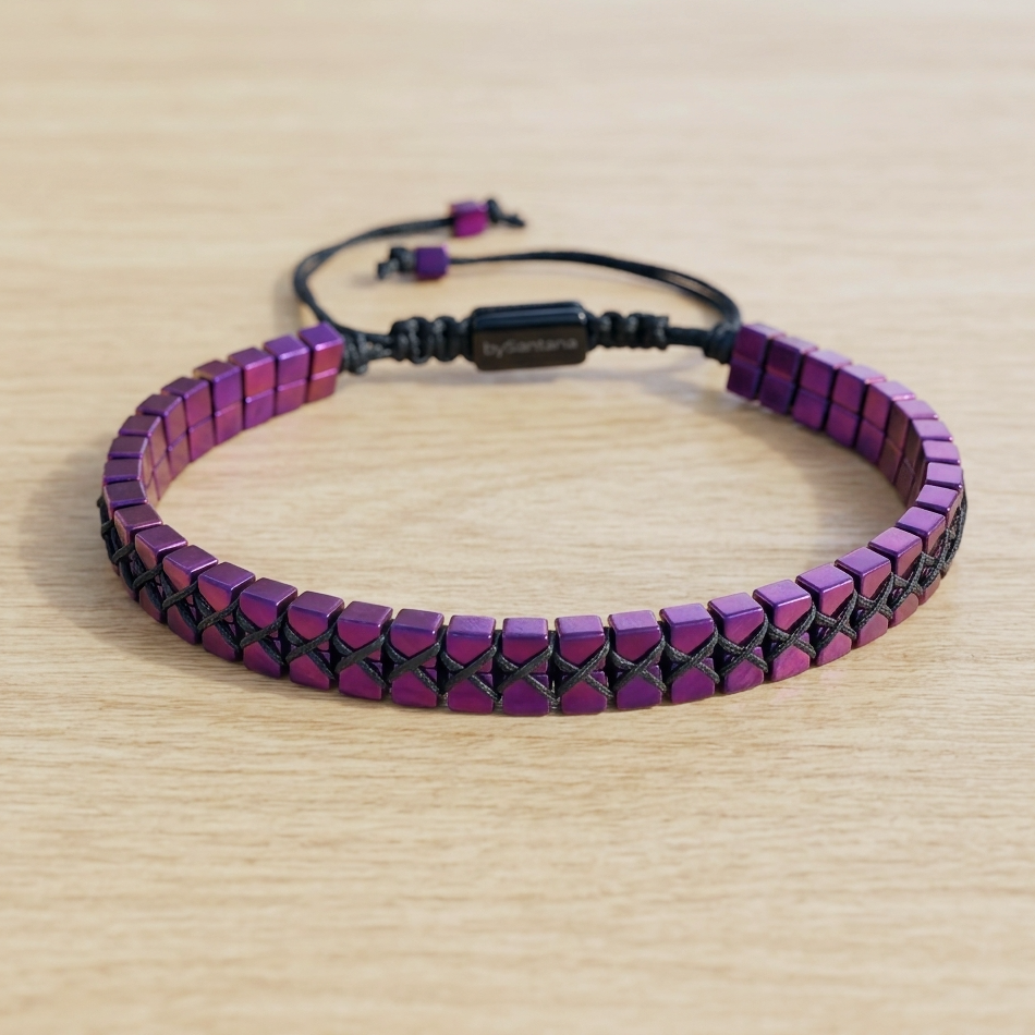 Purple Hematite beaded bracelet on a wooden surface