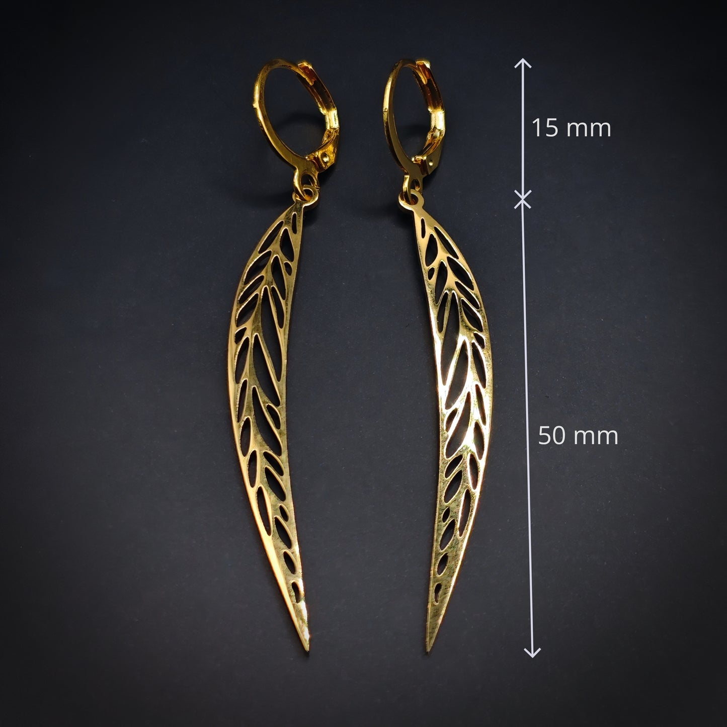 Long pointy gold stainless steel leaf earrings with the measurements shown