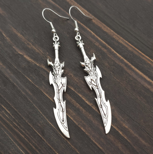 Silver sword earrings with a curved fantasy blade design. A unique gift for RPG players, LARP fans, or gamers.