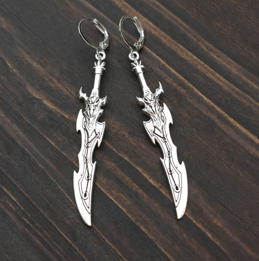 Silver sword earrings with a curved fantasy blade design. A unique gift for RPG players, LARP fans, or gamers.