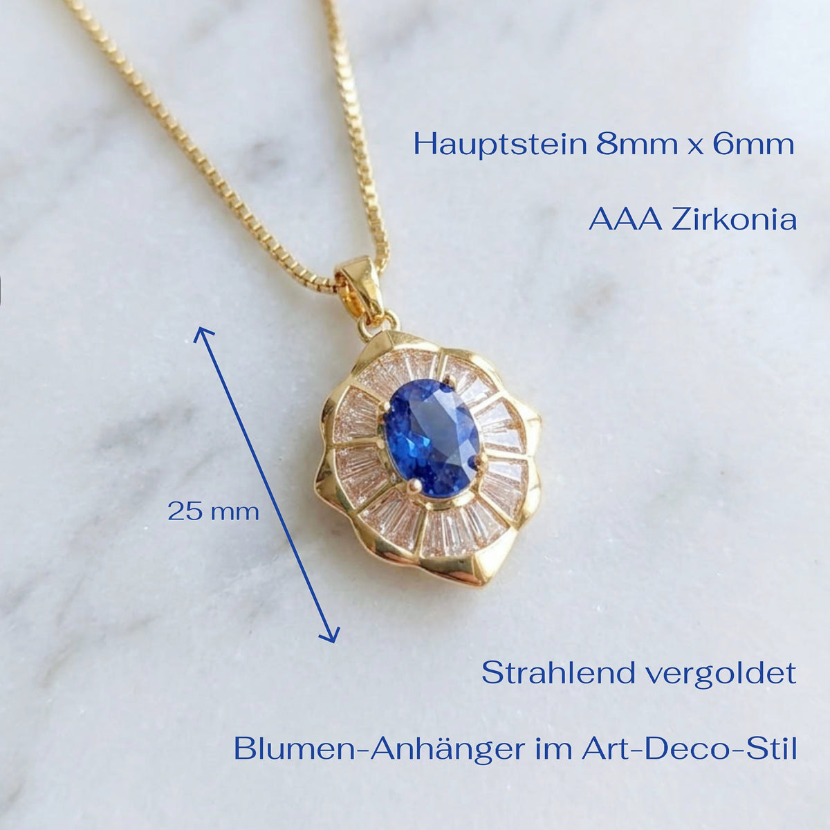 Gold pendant necklace with a blue oval sapphire and clear baguette accents, shown on a white marble background with German text indicating measurements and material details.