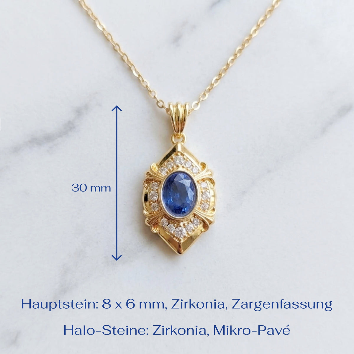 Gold pendant necklace with a blue oval zirconia stone and small clear stones, shown on a white marble background with a 30 mm height measurement marker and German text detailing the main stone and halo stones.