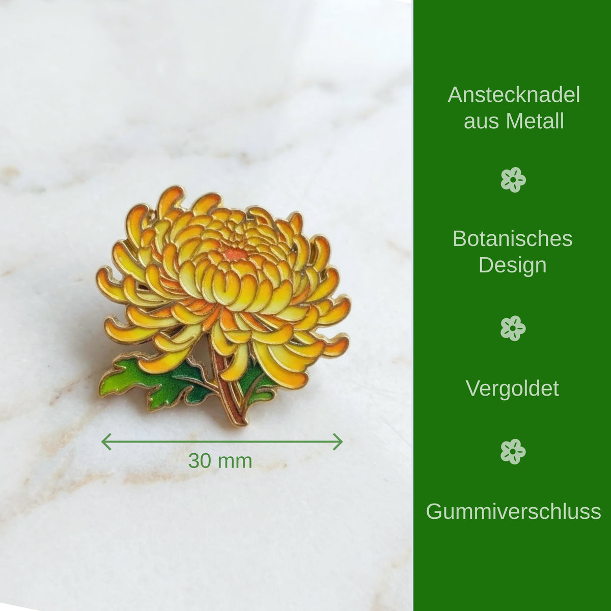 A yellow and orange chrysanthemum flower enamel pin with green leaves, shown on a white marble surface with a green text panel on the right describing features in German.