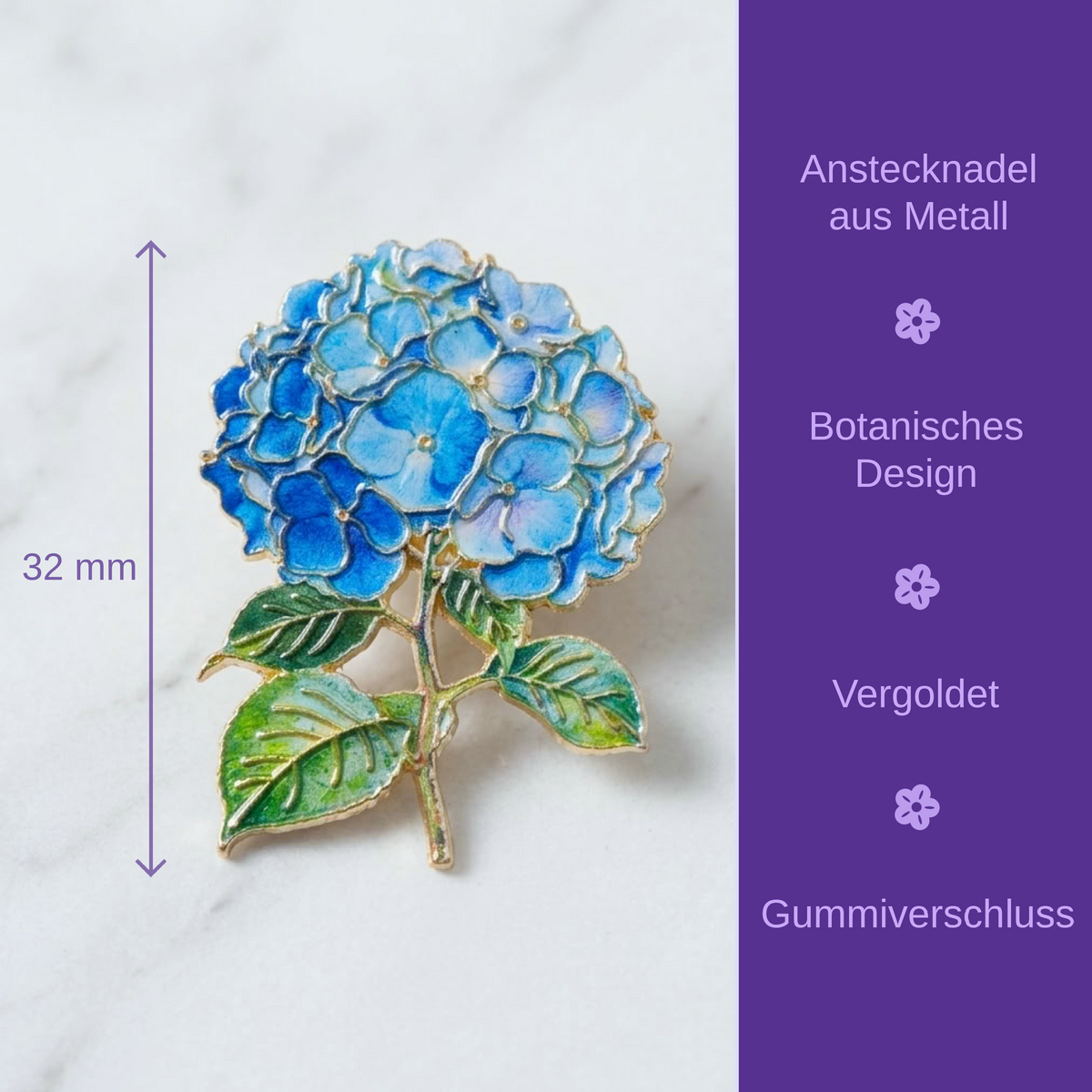 A blue hydrangea flower brooch with green leaves and gold-tone detailing, shown on a white marble surface with a purple side panel containing German text and a 32 mm height measurement.