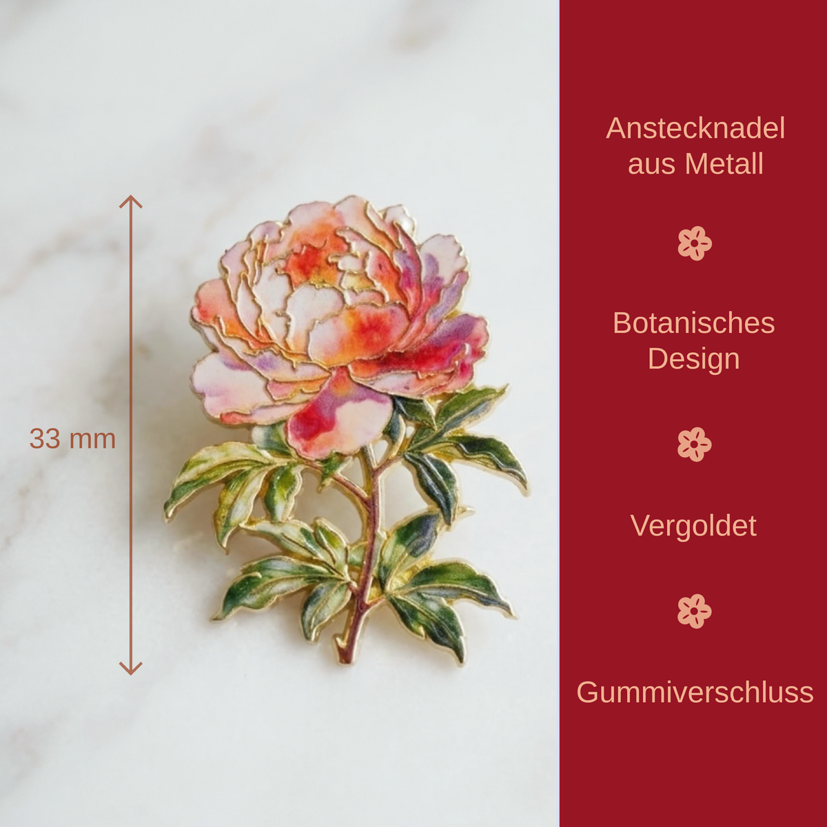 A close-up product photo of an enamel flower pin on a light marble surface, with a dark red vertical panel on the right containing German text and a 33 mm height marker. The product appears to be a peony-style floral pin with layered pink, peach, and white petals, green leaves, and gold-toned outlines.