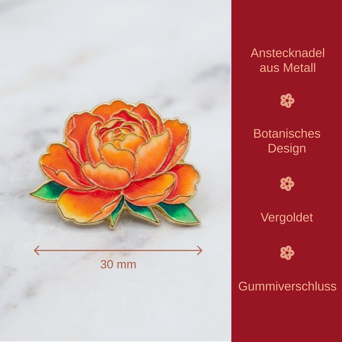 An orange and yellow peony flower enamel pin with green leaves and gold metal trim, shown on a light marble surface with a red text panel on the right listing features in German.