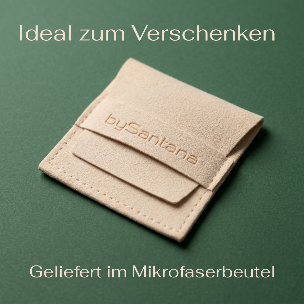 A small beige microfiber pouch with a flap closure and visible stitching, placed on a dark green background. The flap is embossed with the brand name 'bySantana'. White text says that it is ideal for gifting.