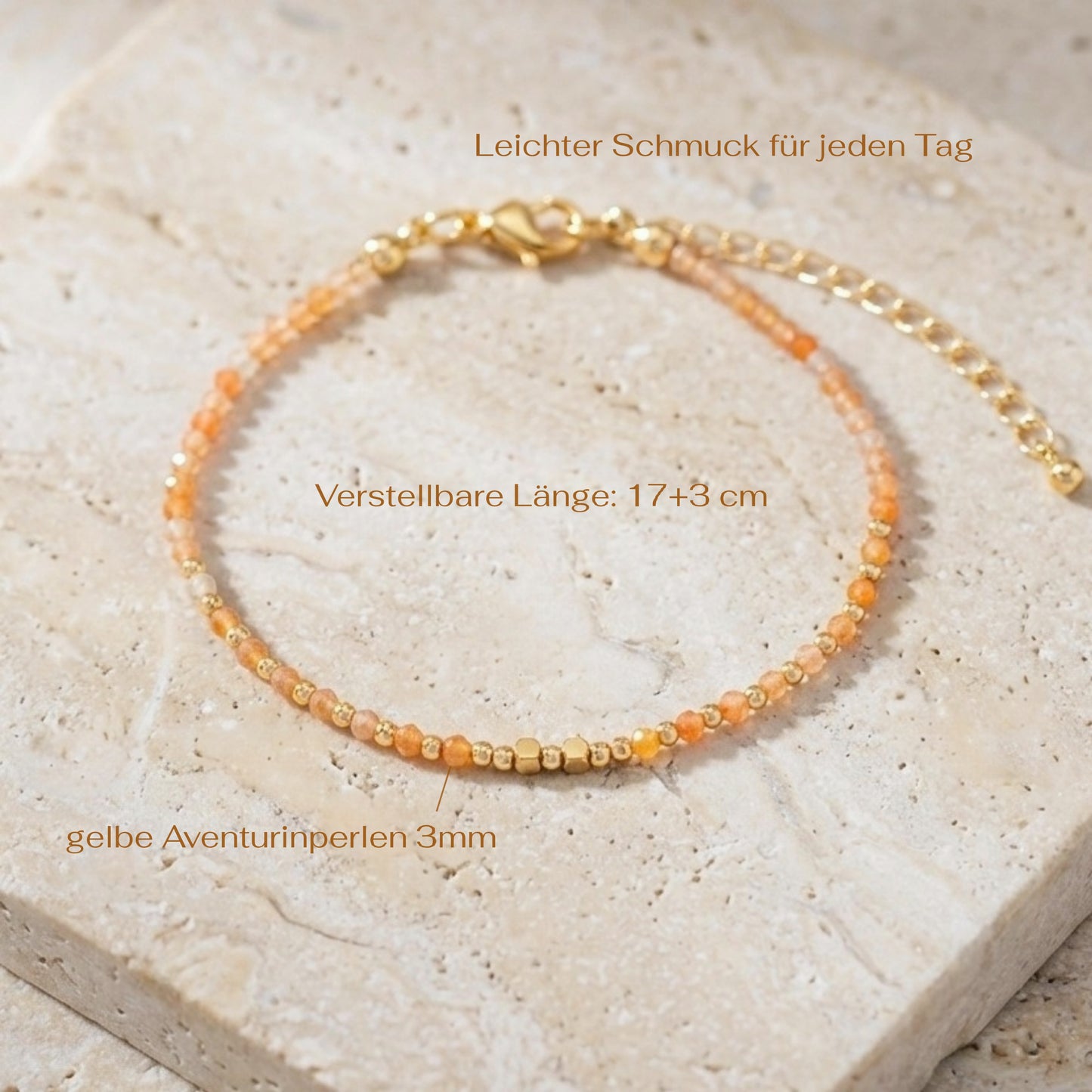 Yellow aventurine beaded boho bracelet with gold spacer beads and orange gemstone beads, on a light stone background with measurements