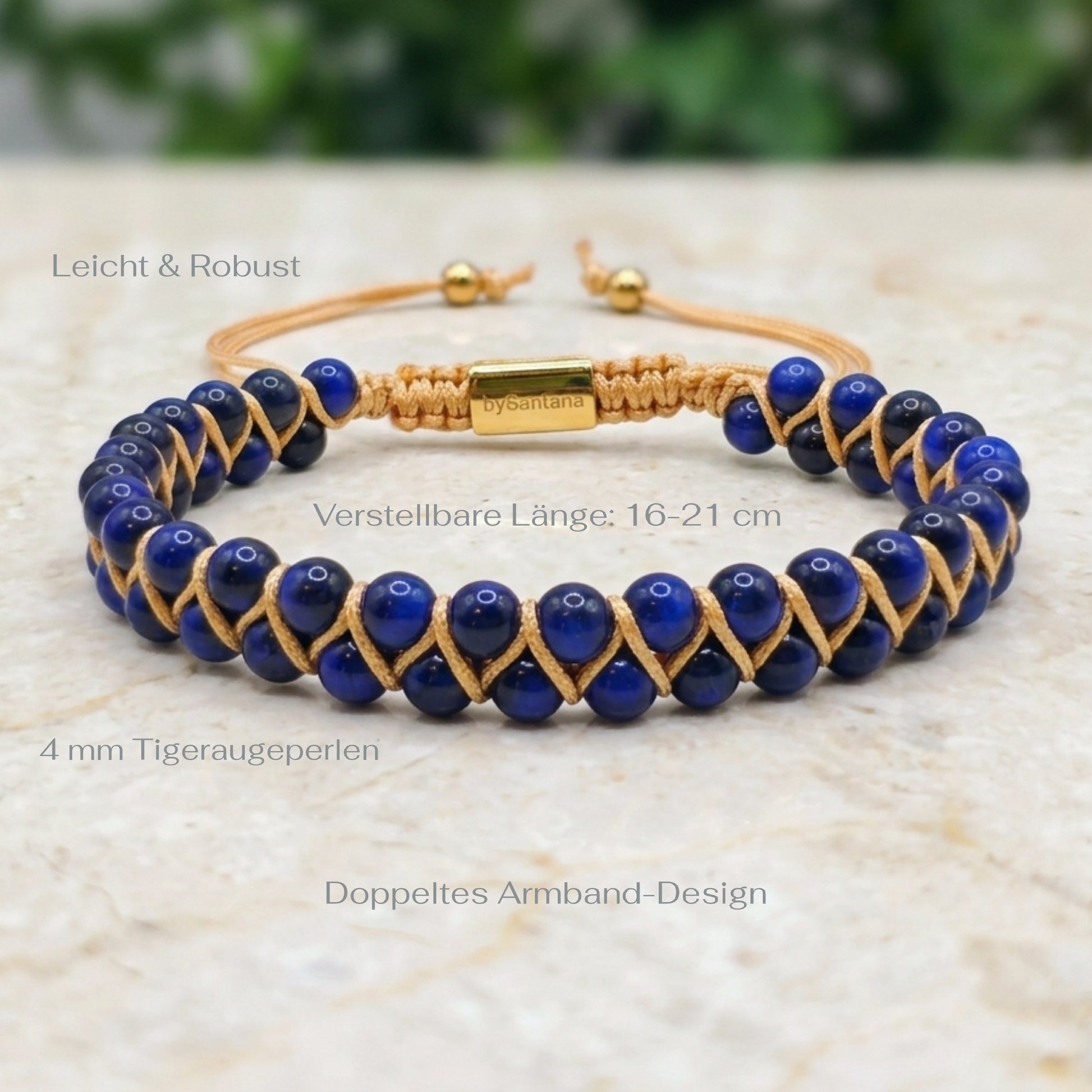 Woven bracelet with blue Tiger's Eye gemstone beads and gold accents on a light surface with measurements