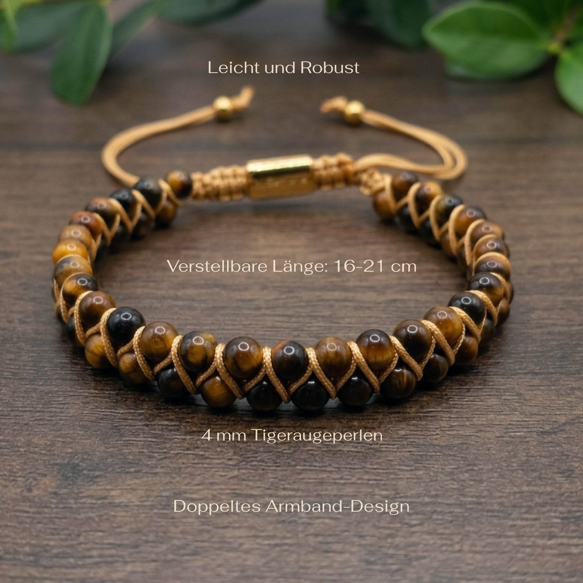 Golden Tiger's Eye beaded gemstone bracelet with gold accents on a wood surface with green leaves in the background and measurements shown