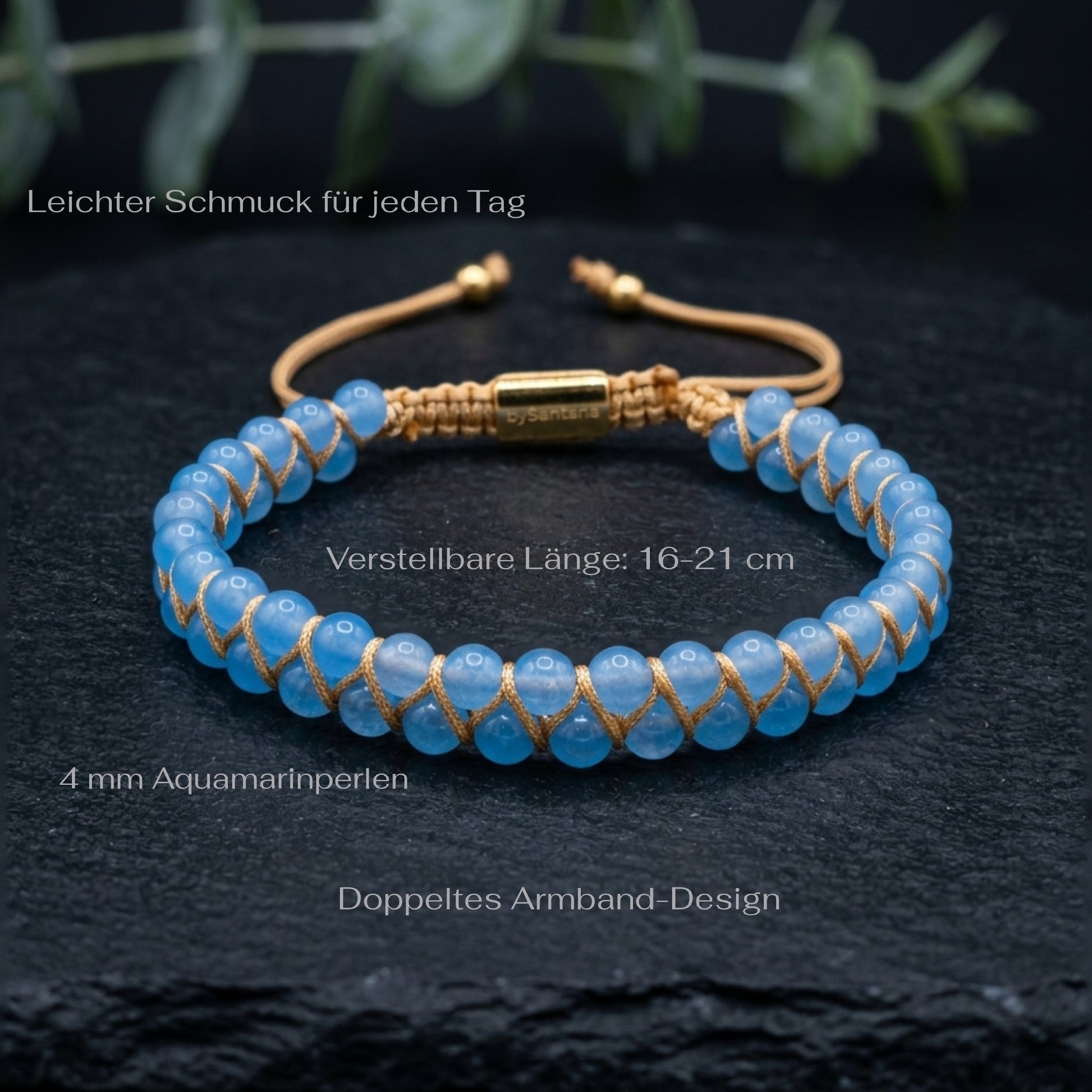 Blue aquamarine beaded gemstone bracelet with gold accents on a dark surface with measurements