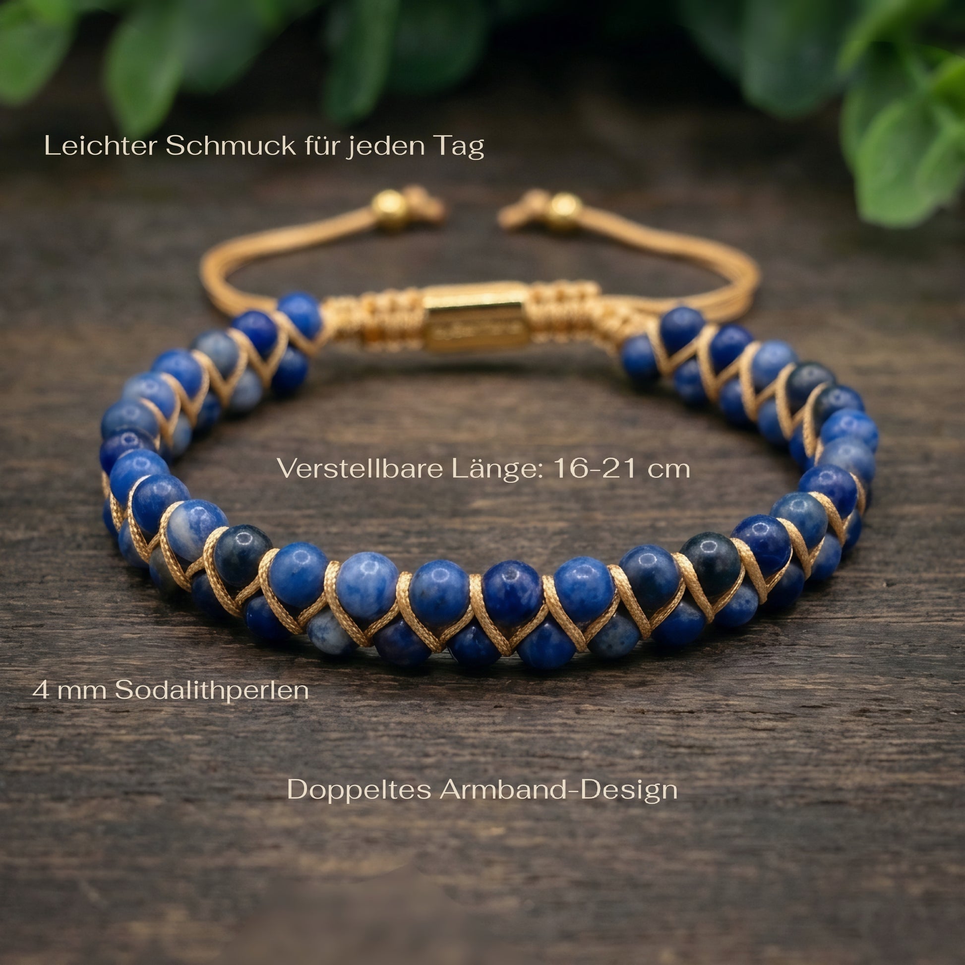 Blue sodalite beaded gemstone bracelet with gold cord on a wood surface with greenery in the background and measurements shown