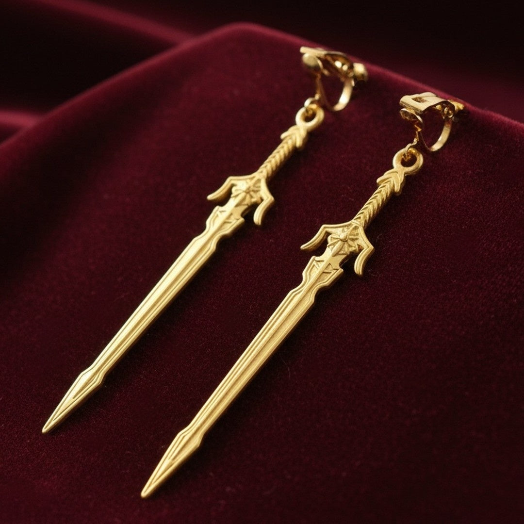 Medieval style fantasy long gold sword earrings with clip-on earrings on a red background