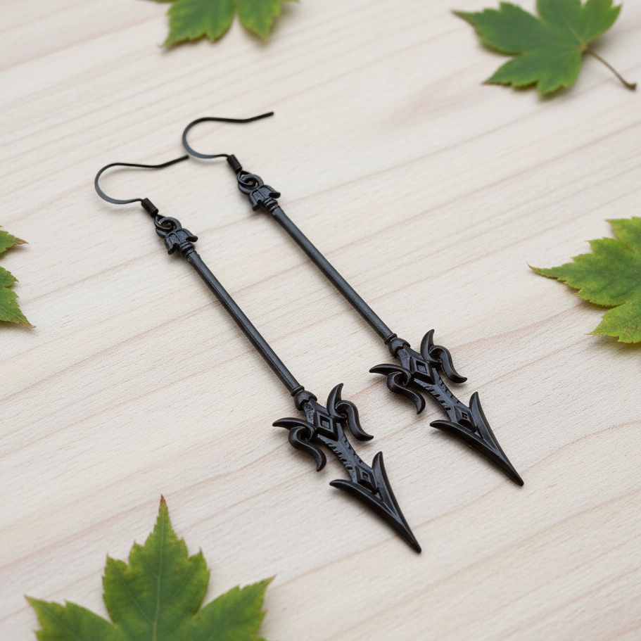 long black mace or axe earrings on a wood background