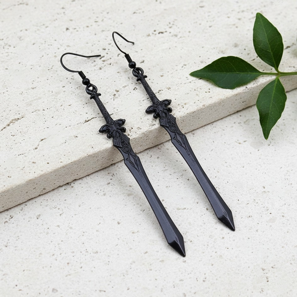 long black sword earrings with a medieval style on a stone background