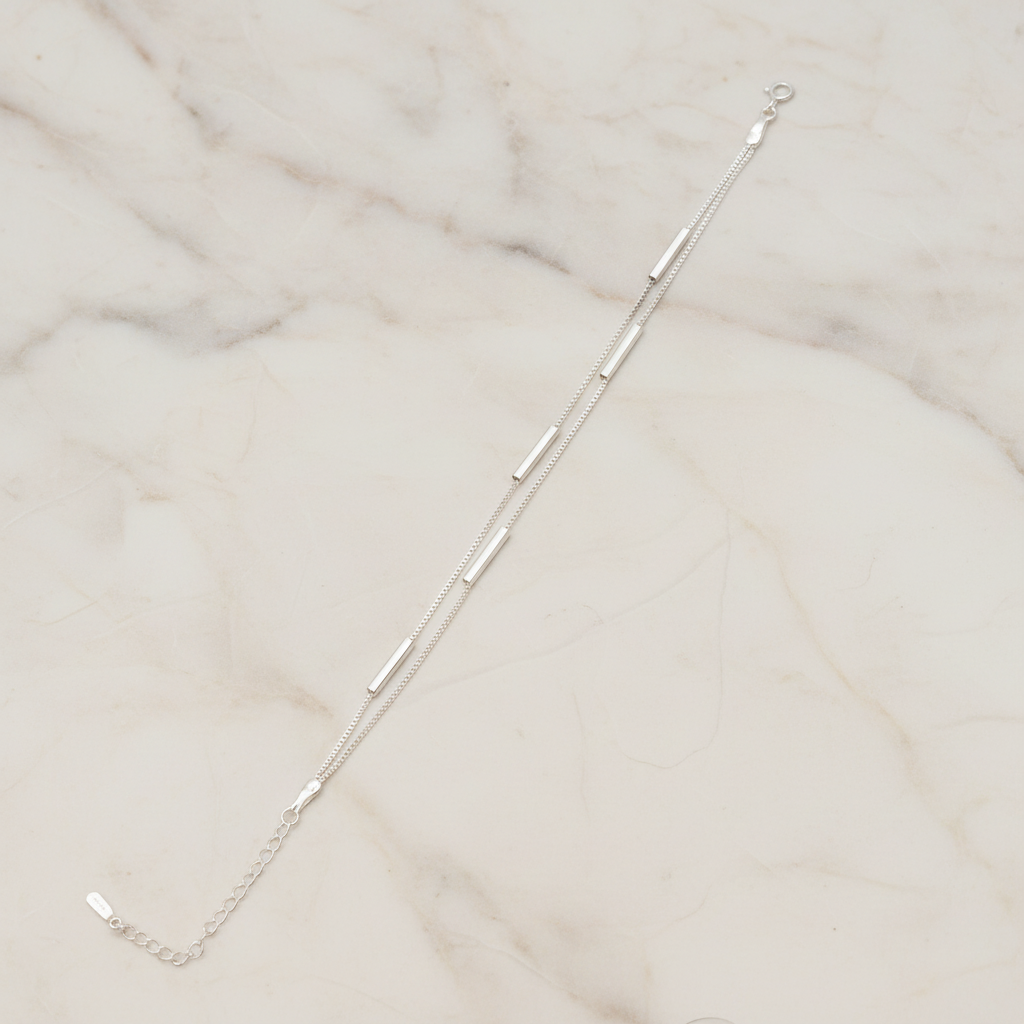 925 Silver Bracelet featuring two Venetian box chains and long silver beads on a light background