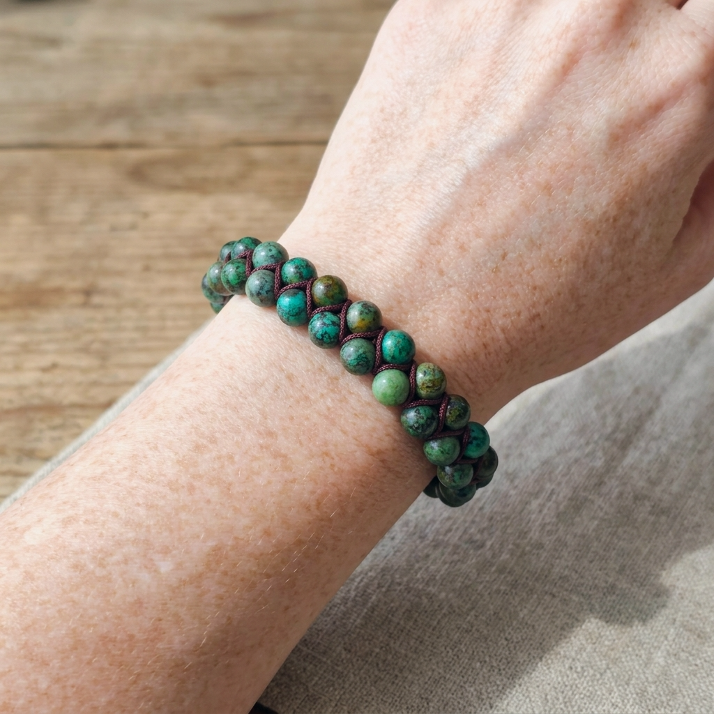 African Turquoise beaded bracelet featuring a double row of beads woven together on a woman's wrist