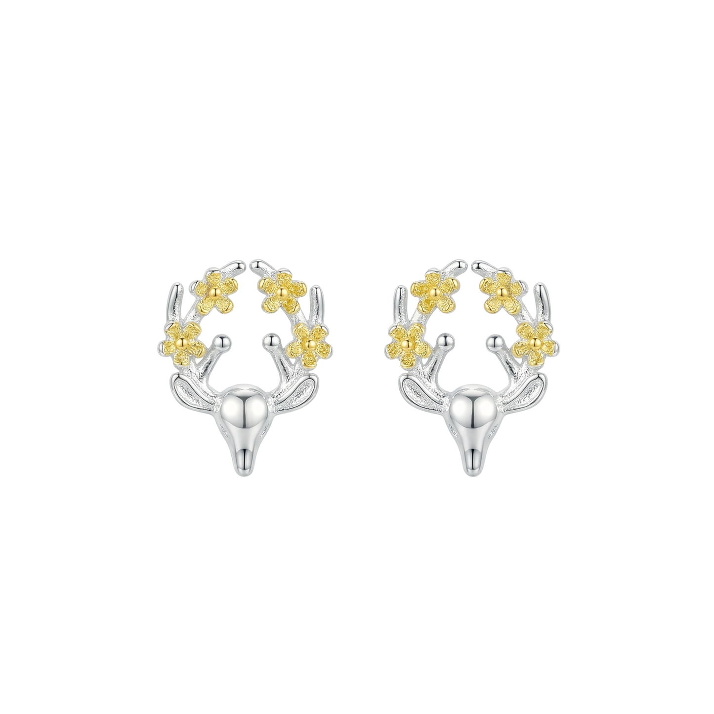 Silver and gold deer shaped earrings with floral details on the antlers on a white background