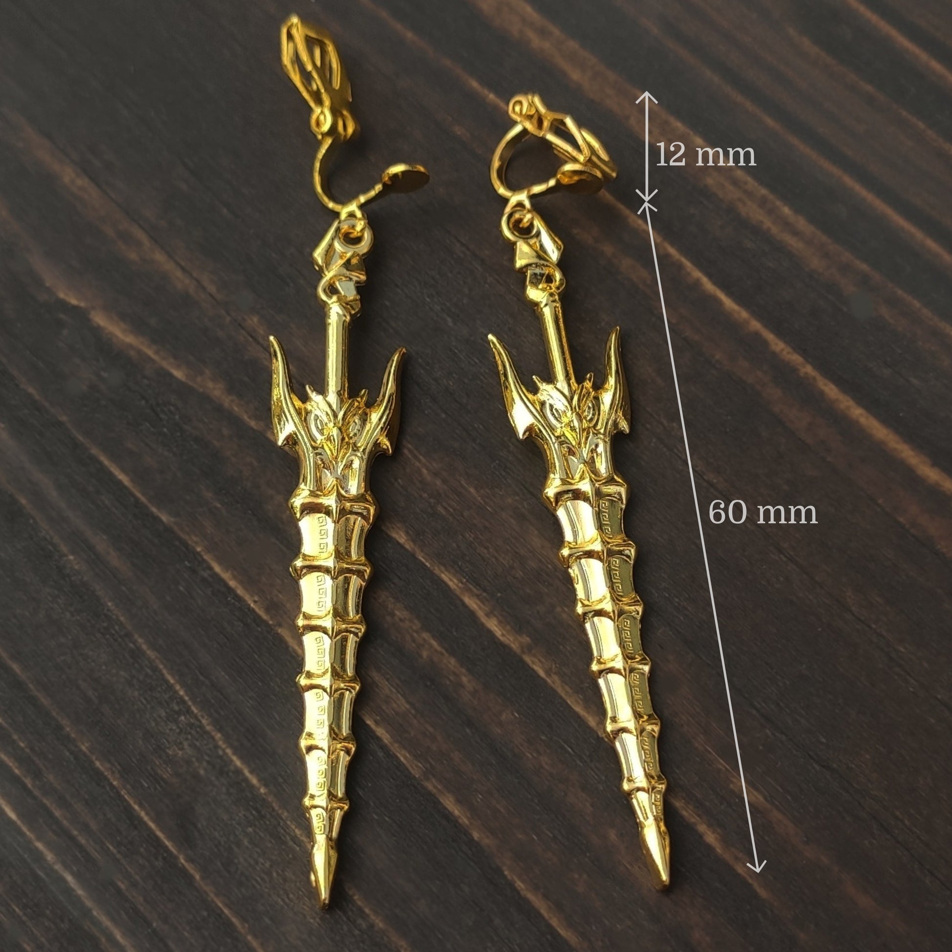 Gold sword earrings with measurements shown