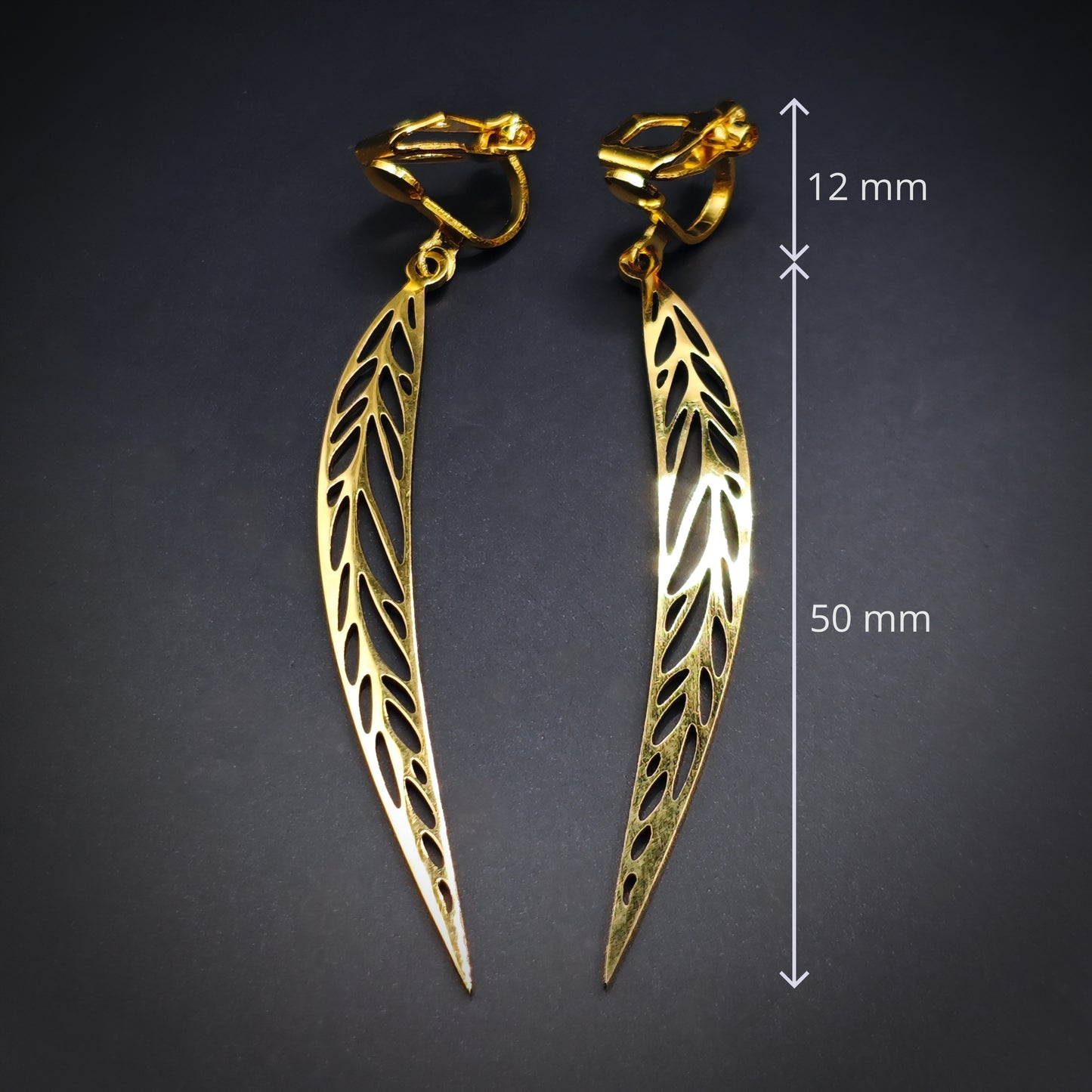 Long gold stainless steel leaf earrings with clip ons and the measurements shown