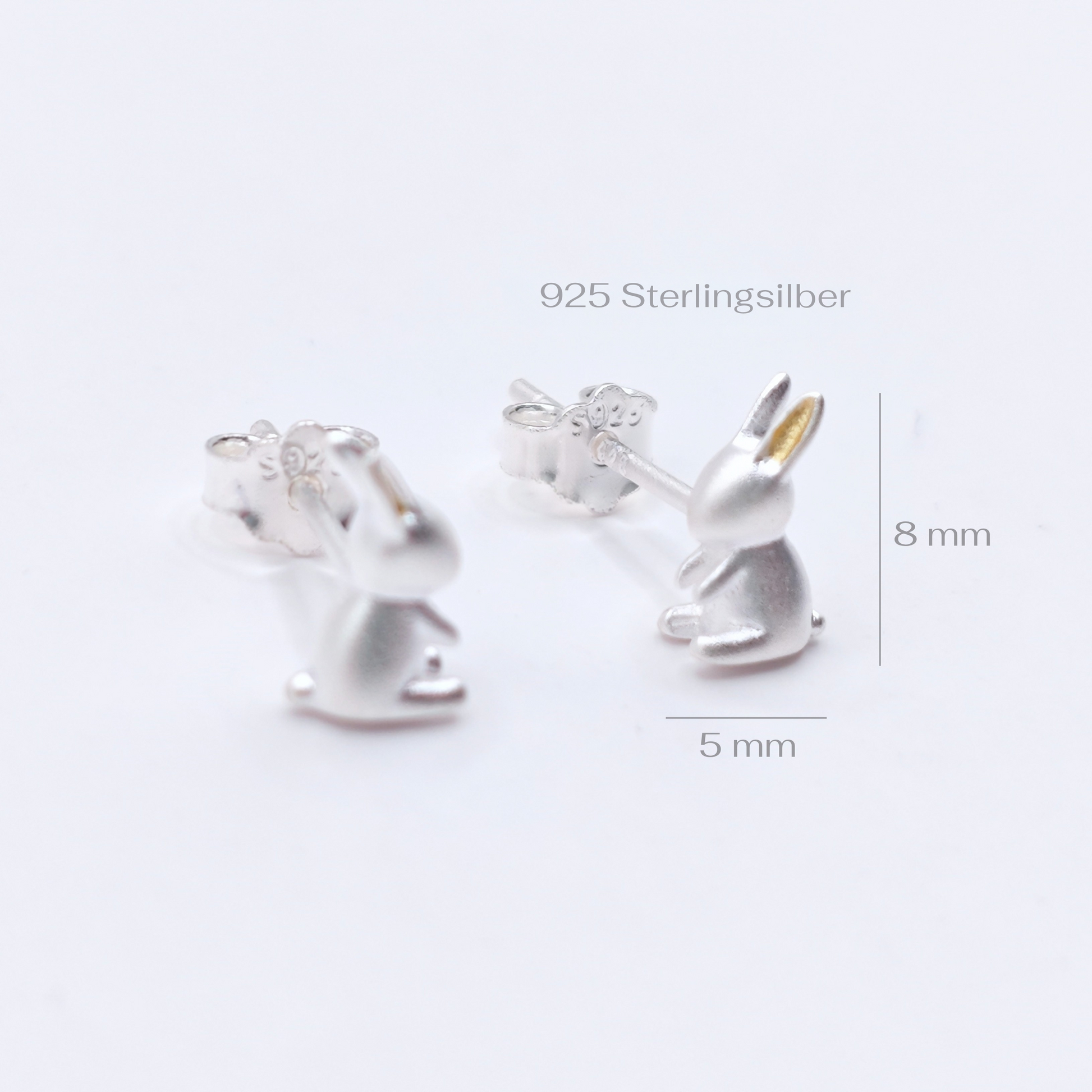 Silver rabbit earrings on a white background with measurements indicated.