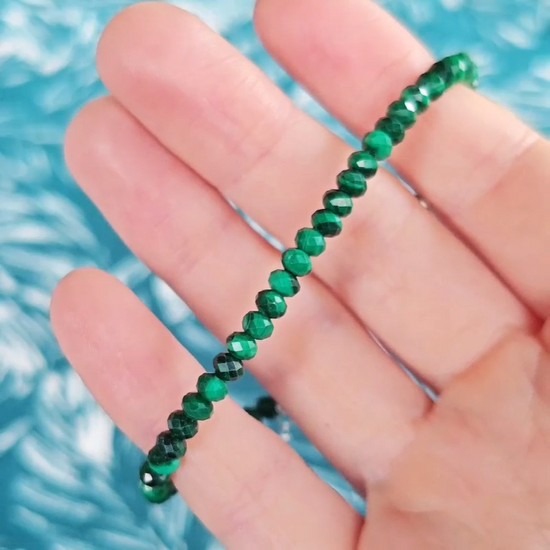 Video close up of a green malachite gemstone bracelet