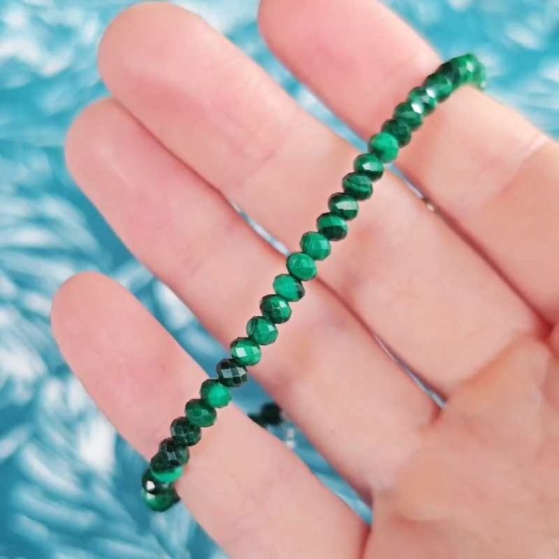 Video close up of a green malachite gemstone bracelet