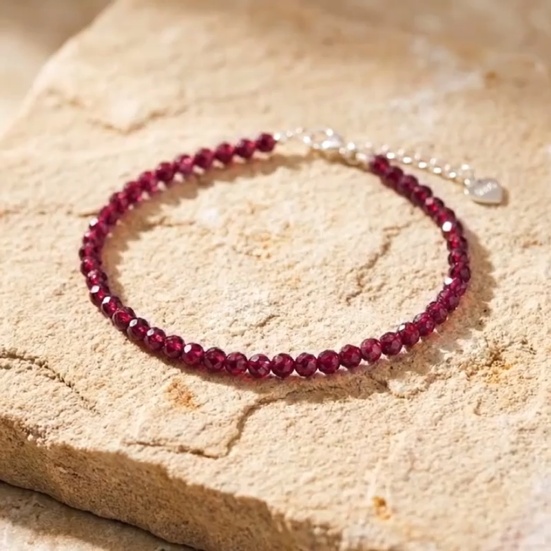 Video close up of a red garnet gemstone bracelet