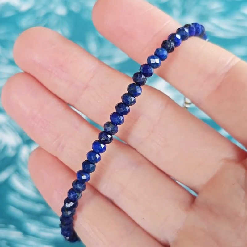 Video close up of a blue lapis lazuli gemstone bracelet