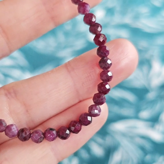 Video close up of a red ruby gemstone bracelet