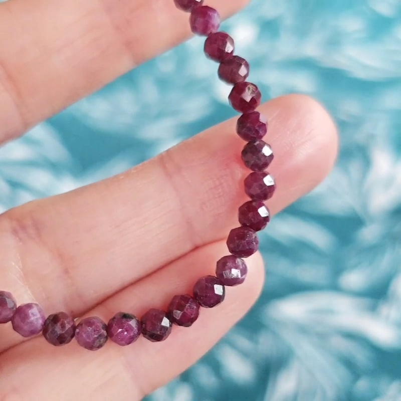 Video close up of a red ruby gemstone bracelet